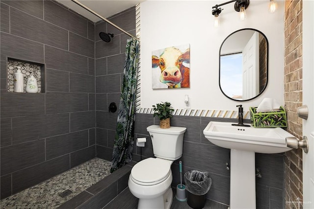 bathroom featuring toilet and walk in shower