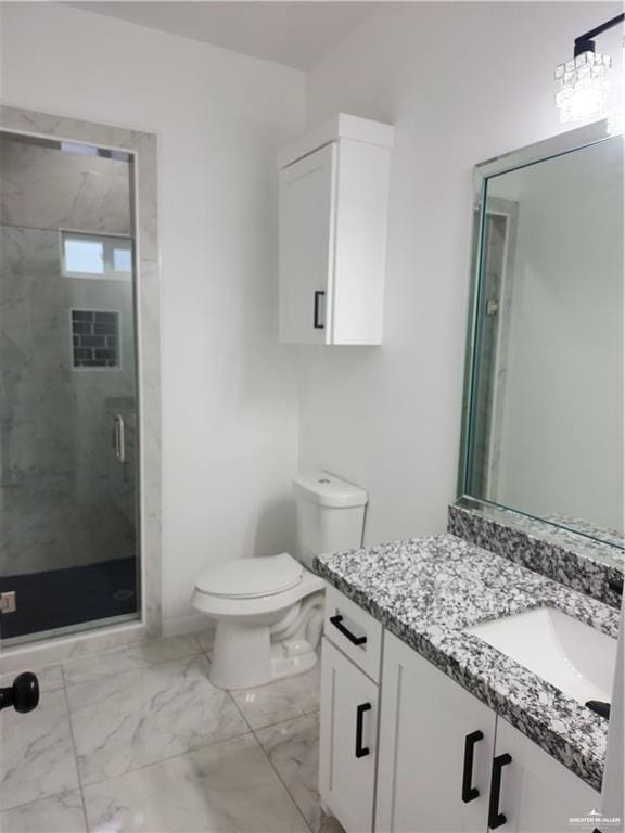 bathroom with vanity, toilet, and an enclosed shower