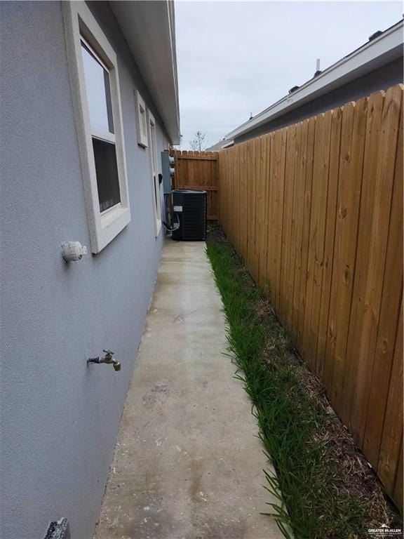 view of side of property featuring cooling unit