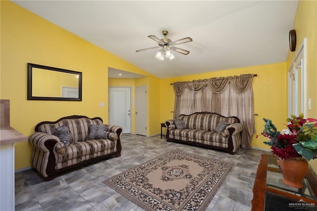 living room with ceiling fan and vaulted ceiling