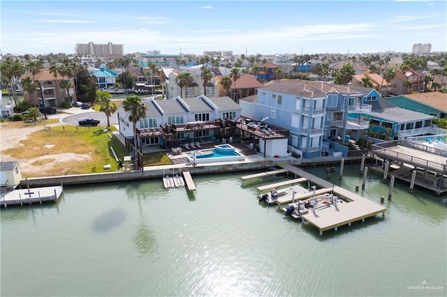 5705 Laguna Cir S, South Padre Island, TX 78597 - birds eye view of property featuring a water view and a residential view