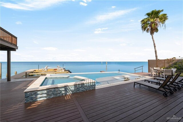 5705 Laguna Cir S, South Padre Island, TX 78597 - view of pool with a deck with water view and a pool with connected hot tub