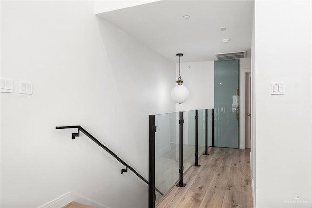 5705 Laguna Cir S, South Padre Island, TX 78597 - stairway with wood finished floors and visible vents