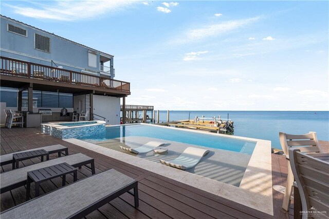 5705 Laguna Cir S, South Padre Island, TX 78597 - view of pool featuring a deck with water view and a pool with connected hot tub