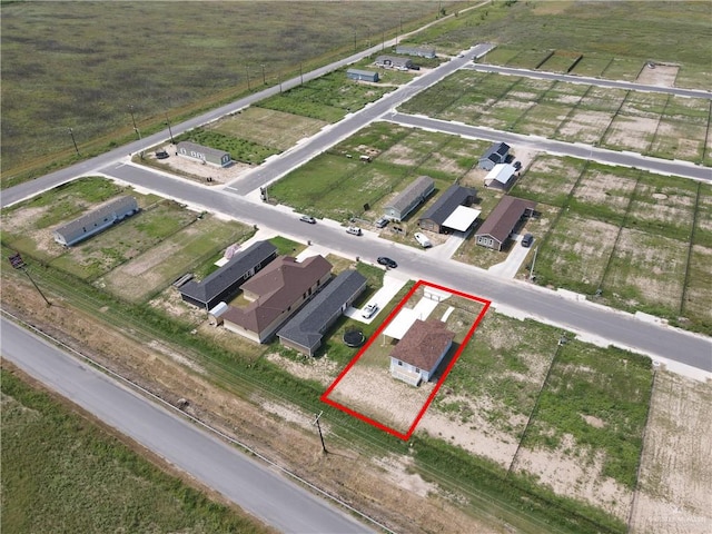 birds eye view of property featuring a rural view