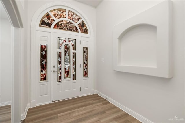 foyer entrance with hardwood / wood-style flooring