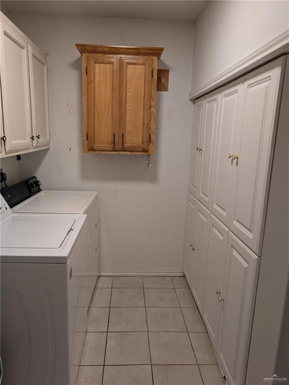 109 Green Gate Cir N, Palmview, TX 78572 - laundry area with washer and clothes dryer, cabinet space, and light tile patterned floors