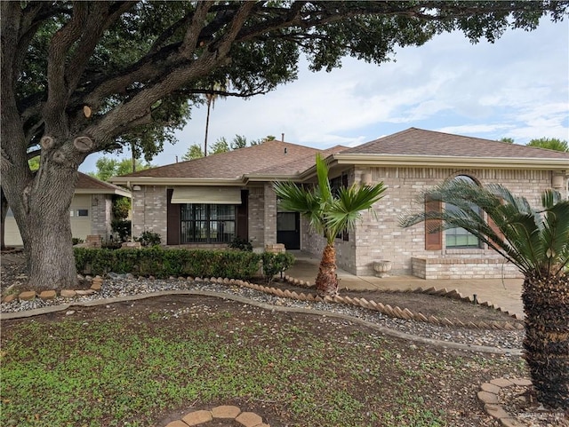 109 Green Gate Cir N, Palmview, TX 78572 - view of front facade with brick siding and a shingled roof