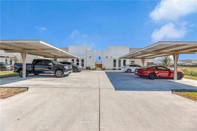 view of vehicle parking with a carport