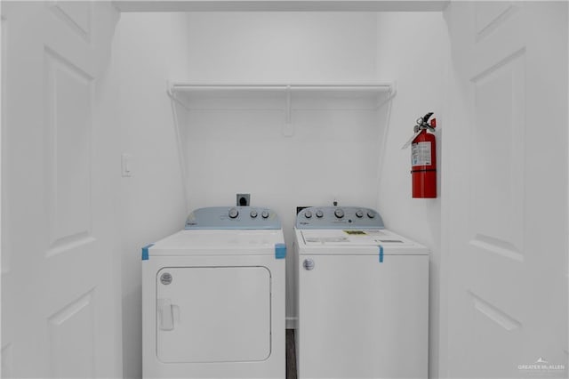 laundry room with washing machine and dryer