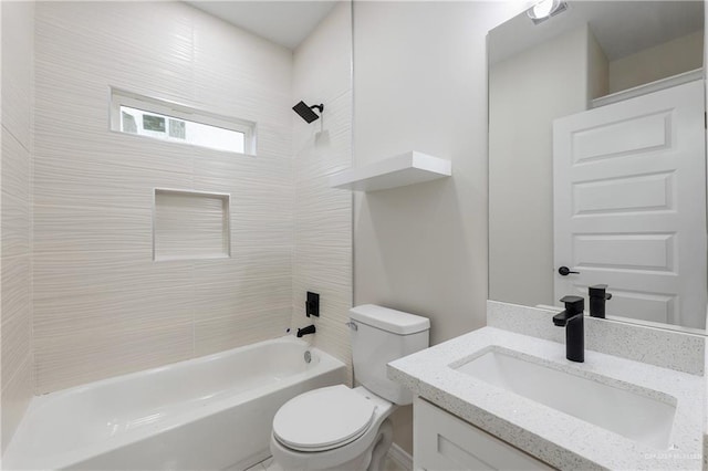 full bathroom featuring toilet, vanity, and tiled shower / bath