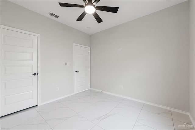 empty room featuring ceiling fan