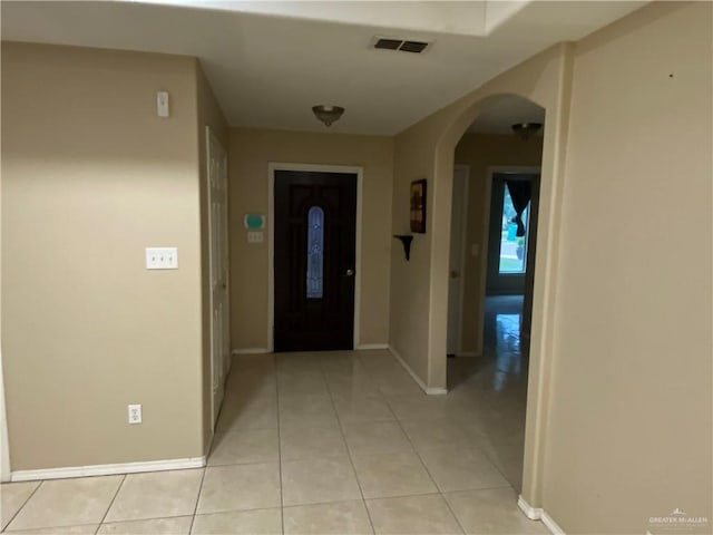 8500 S Norma St, Pharr, TX 78577 - entrance foyer with arched walkways, baseboards, visible vents, and light tile patterned flooring