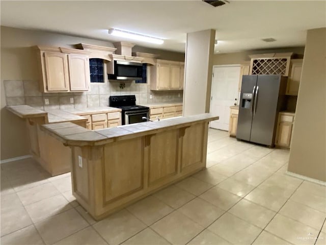 8500 S Norma St, Pharr, TX 78577 - kitchen with stainless steel appliances, backsplash, tile counters, and light tile patterned floors