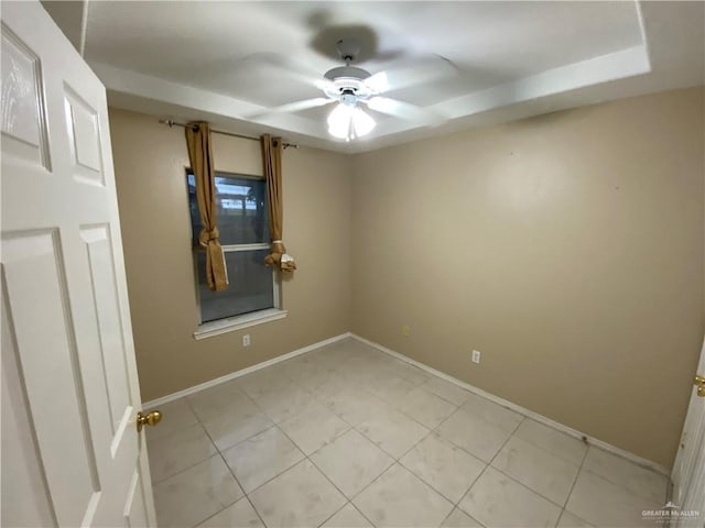 8500 S Norma St, Pharr, TX 78577 - unfurnished room featuring baseboards, a tray ceiling, and ceiling fan