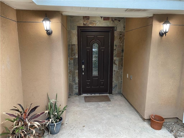 8500 S Norma St, Pharr, TX 78577 - doorway to property with stucco siding and stone siding