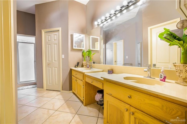 bathroom featuring tile patterned flooring and vanity