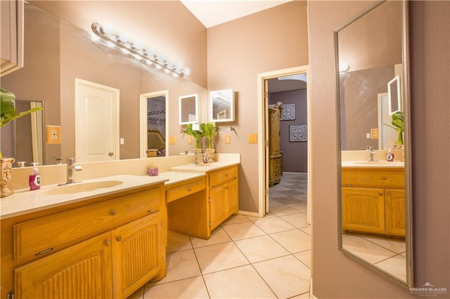 bathroom with tile patterned floors and vanity