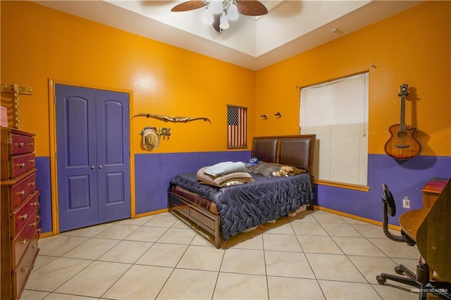 bedroom with ceiling fan and light tile patterned flooring