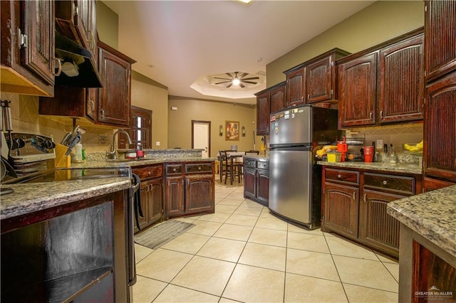 kitchen with ceiling fan, sink, backsplash, light tile patterned flooring, and appliances with stainless steel finishes