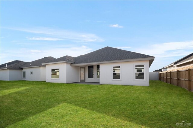 820 N Brushfield Ave, Edinburg, TX 78541 - back of property featuring stucco siding and roof with shingles