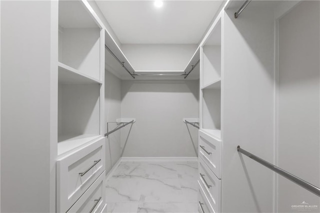 2208 Zinnia St, Weslaco, TX 78599 - walk in closet featuring light marble finish floors
