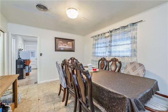 1601 Walnut Ave, Mcallen, TX 78501 - dining room featuring crown molding and baseboards