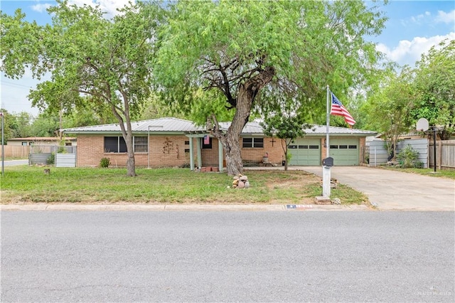 1601 Walnut Ave, Mcallen, TX 78501 - ranch-style house with concrete driveway and brick siding
