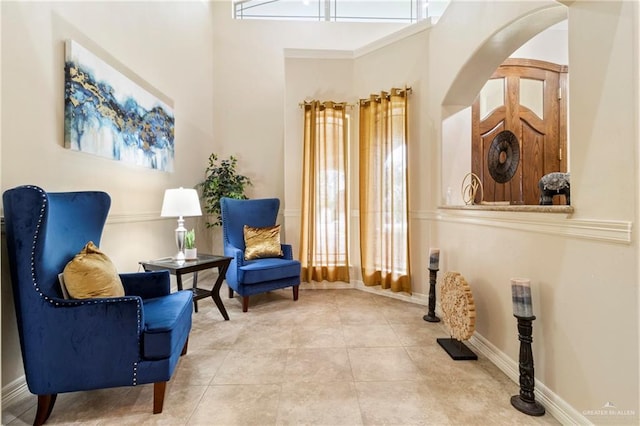 1625 Gabriels Lndg, Harlingen, TX 78550 - sitting room featuring tile patterned floors, a towering ceiling, and baseboards