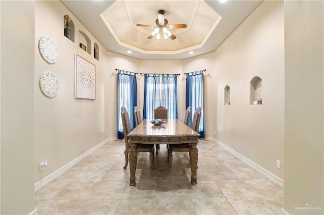 1625 Gabriels Lndg, Harlingen, TX 78550 - dining area with ceiling fan, baseboards, a raised ceiling, and light tile patterned floors