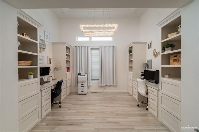 office featuring light hardwood / wood-style flooring and a chandelier