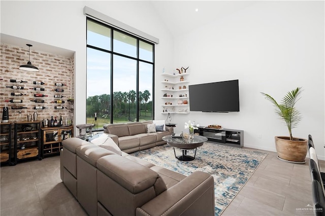 tiled living room with high vaulted ceiling