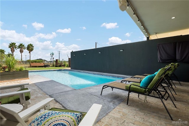 view of pool featuring a patio