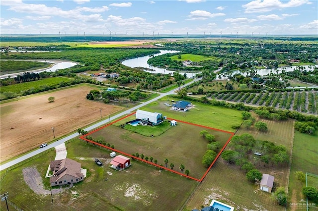 aerial view with a rural view and a water view