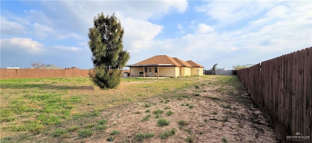 view of yard with a fenced backyard