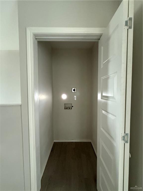 interior space featuring hookup for an electric dryer and dark hardwood / wood-style flooring