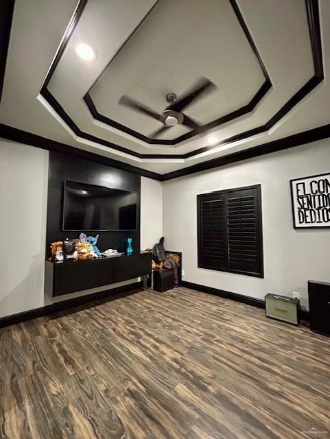 2417 E 28th St, Mission, TX 78574 - living area with a raised ceiling, a ceiling fan, ornamental molding, and wood finished floors