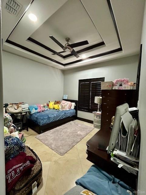 2417 E 28th St, Mission, TX 78574 - bedroom featuring a raised ceiling and ceiling fan