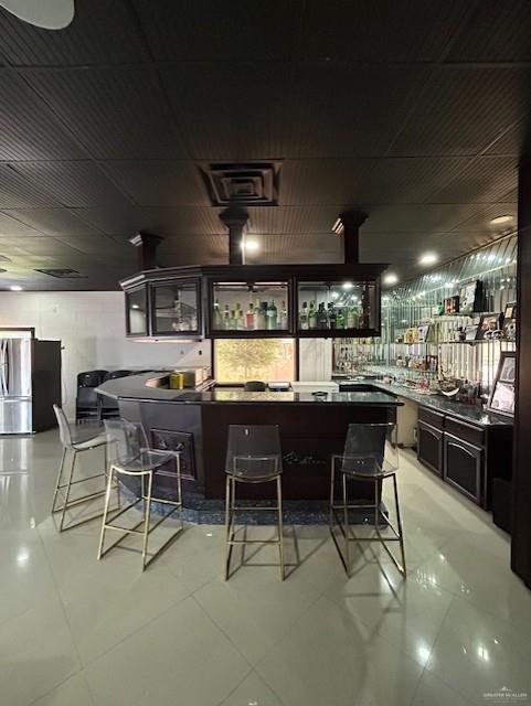 2417 E 28th St, Mission, TX 78574 - bar area featuring freestanding refrigerator