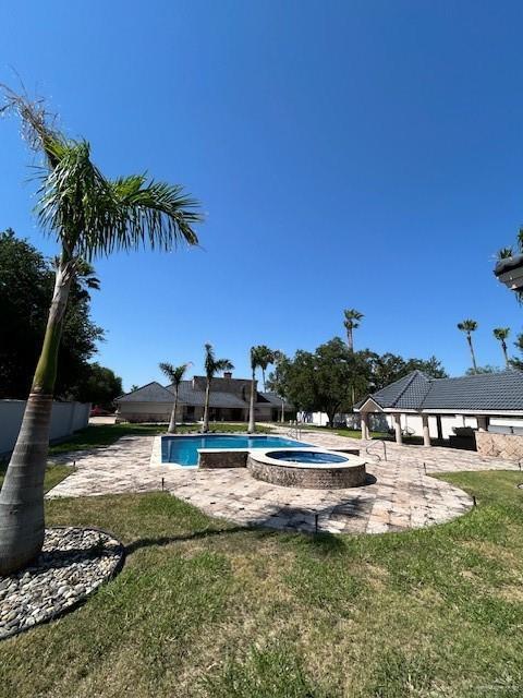 2417 E 28th St, Mission, TX 78574 - outdoor pool featuring a gazebo, an in-ground hot tub, a patio area, and a lawn