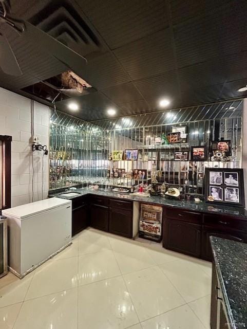 2417 E 28th St, Mission, TX 78574 - bar featuring light tile patterned floors and refrigerator
