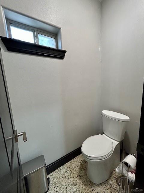 2417 E 28th St, Mission, TX 78574 - bathroom with toilet and speckled floor