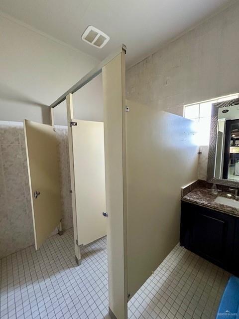 2417 E 28th St, Mission, TX 78574 - bathroom with tile patterned flooring and vanity