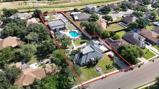 2417 E 28th St, Mission, TX 78574 - aerial perspective of suburban area featuring property boundaries highlighted and a pool