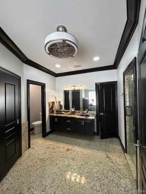2417 E 28th St, Mission, TX 78574 - full bathroom with ornamental molding, double vanity, speckle patterned floor, and recessed lighting