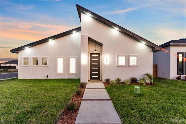 contemporary home featuring a yard