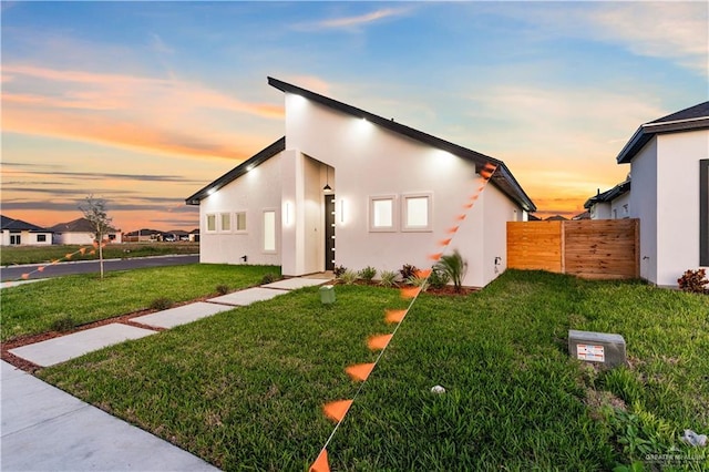 view of front of property with a yard