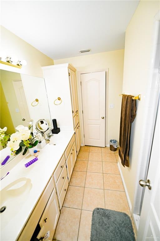 bathroom with tile patterned floors and vanity