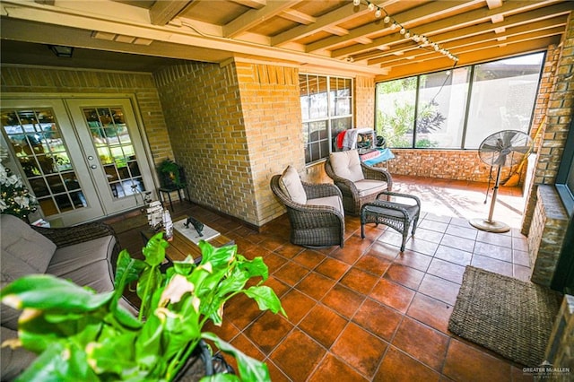 sunroom featuring french doors