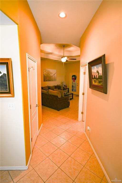 hall featuring light tile patterned flooring